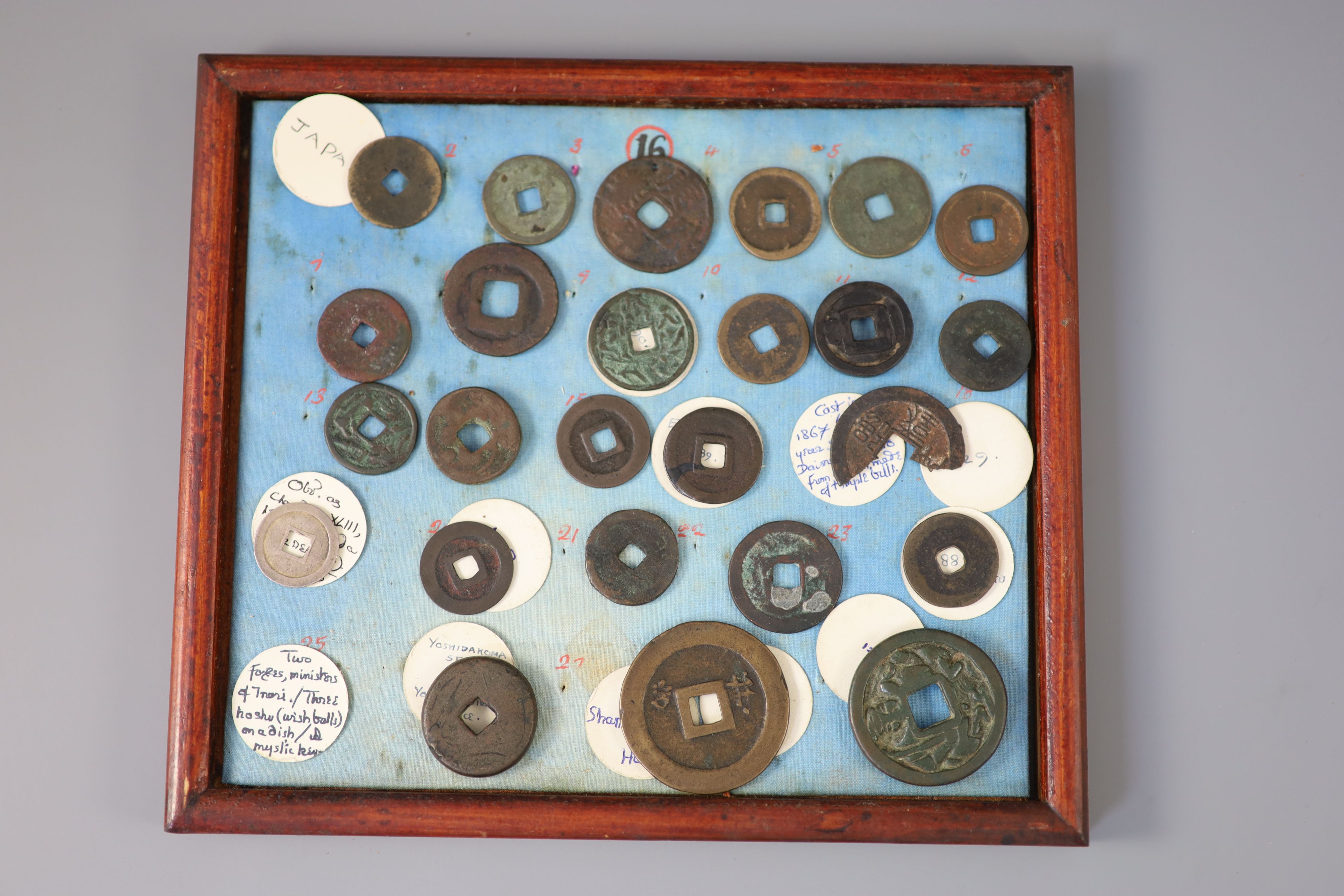 A group of 40 Japanese bronze and metal amulets or charms, 19th/20th century,